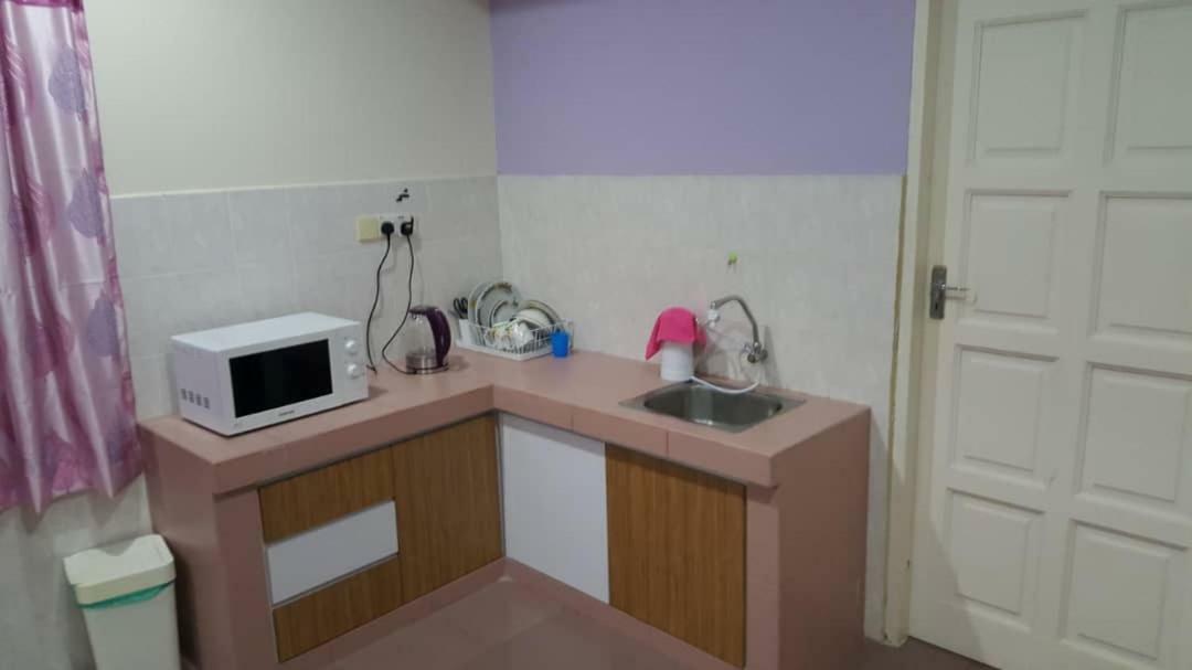 The Garden Vacation Home Lumut Bagian luar foto